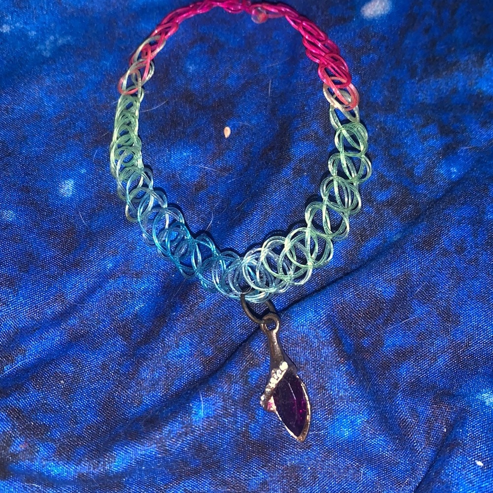 Choker with a charm on it